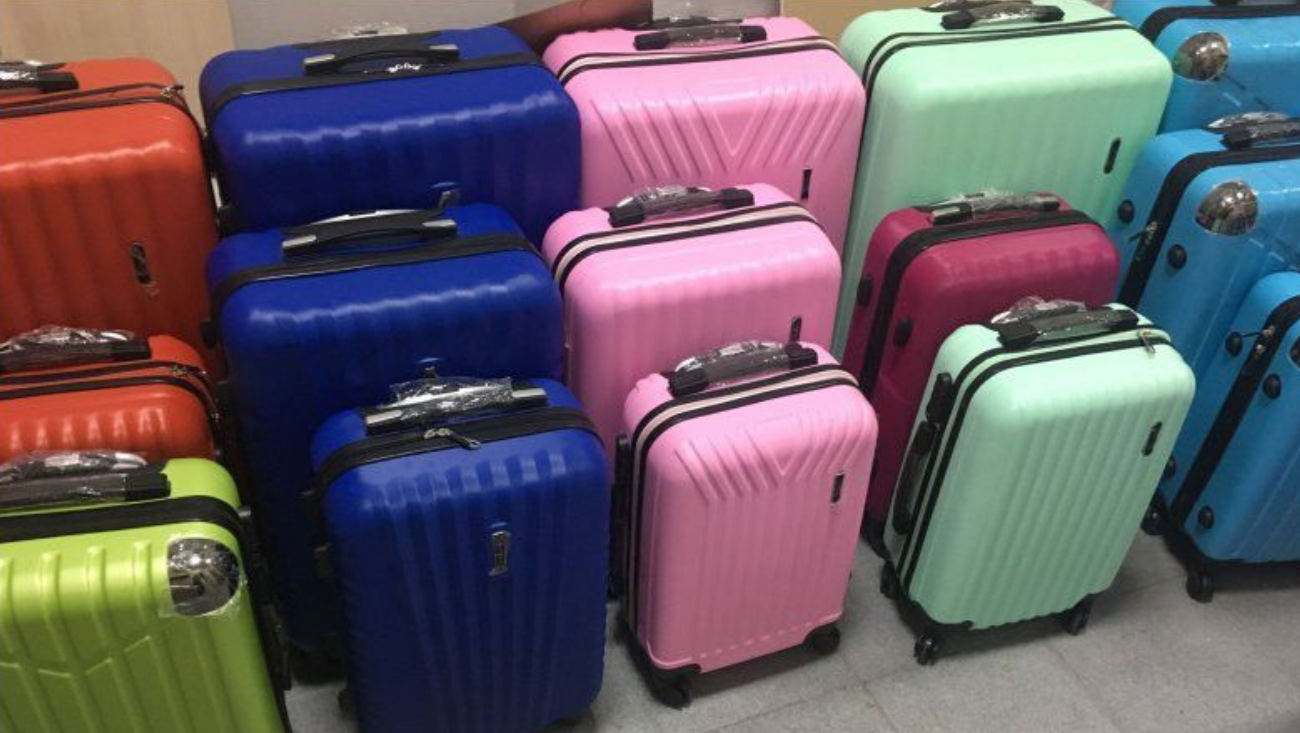 Как купить и доставить чемоданы из Китая в Россию оптом